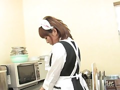 Hot maid masturbates in the kitchen with a toy